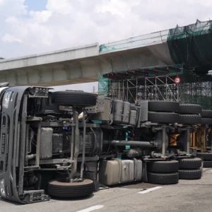 Truck topples along PLUS highway