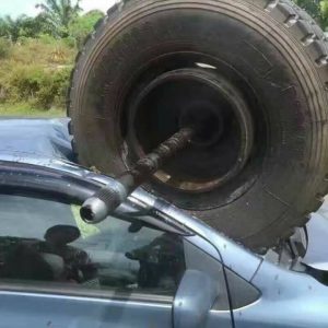 Truck axle breaks and hits car